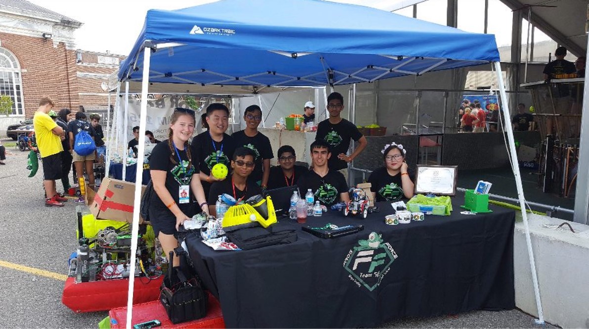 frog force students at a stand